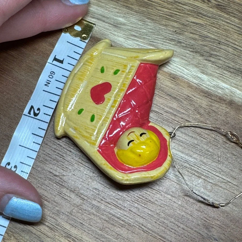 Vintage Handmade Korea Baby in Cradle Ornament Yellow Red Heart Rocking Bassinet